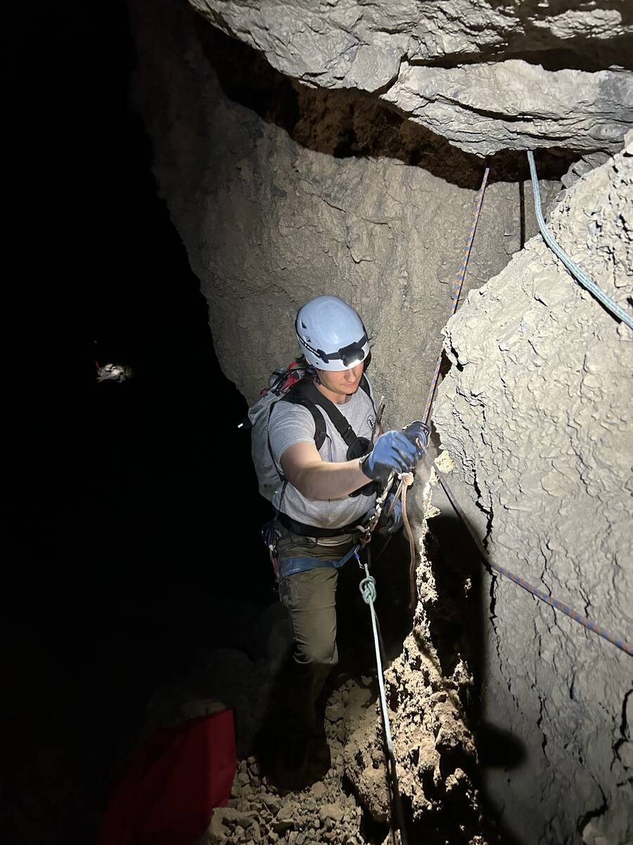 A park ranger prepares to rappel after lowering the stranded hiker. (National Park Service/Phil ...