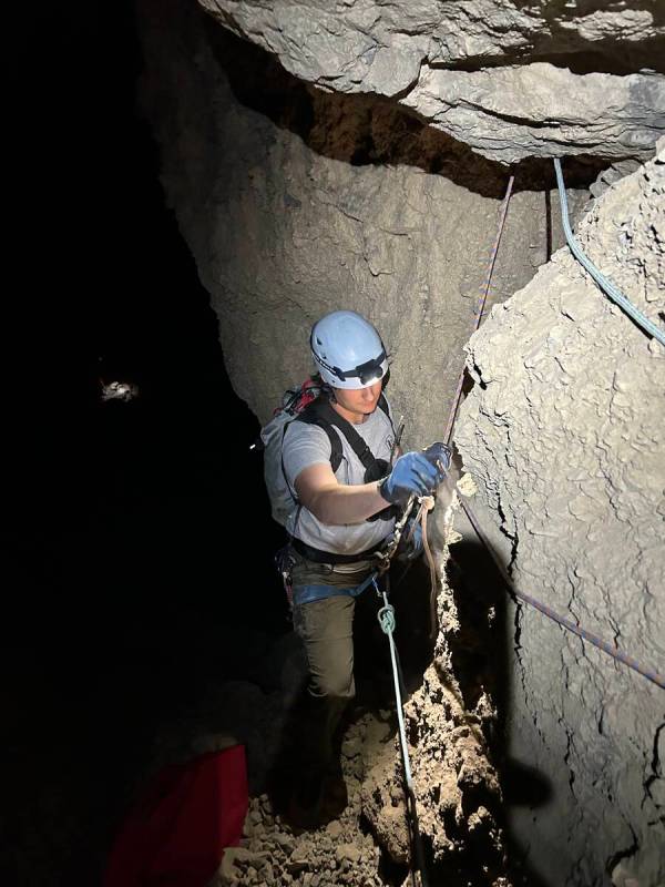 A park ranger prepares to rappel after lowering the stranded hiker. (National Park Service/Phil ...