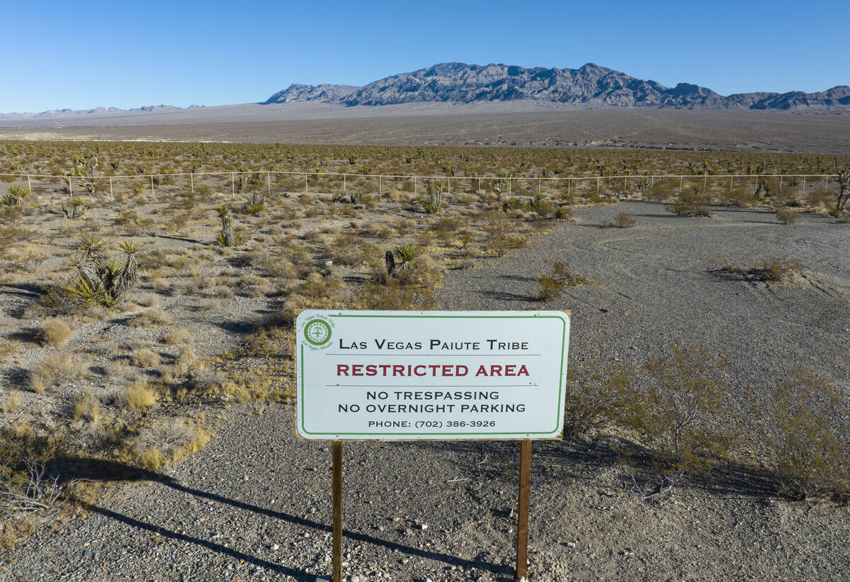 A restricted area sign is posted near a plot of land at the north of the Paiute reservation and ...