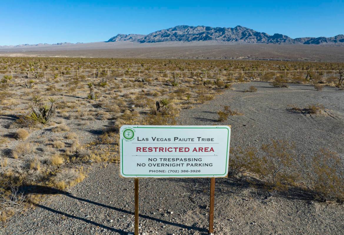 A restricted area sign is posted near a plot of land at the north of the Paiute reservation and ...