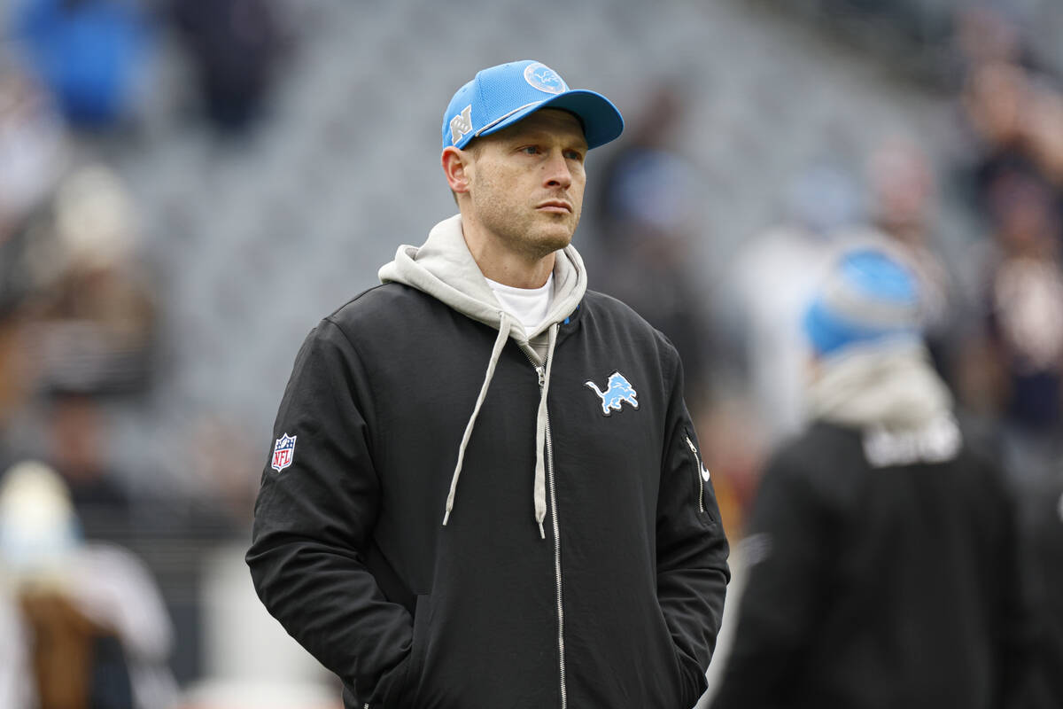 Detroit Lions offensive coordinator Ben Johnson walks on Soldier Field before an NFL football g ...