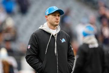 Detroit Lions offensive coordinator Ben Johnson walks on Soldier Field before an NFL football g ...