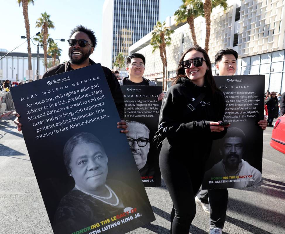 Kelvin Johnson with Resorts World marches in the 43rd annual Martin Luther King Jr. Day parade ...