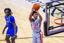 UNLV guard Dedan Thomas Jr. (11) gets off a jumps shot past San Jose State Spartans guard Will ...