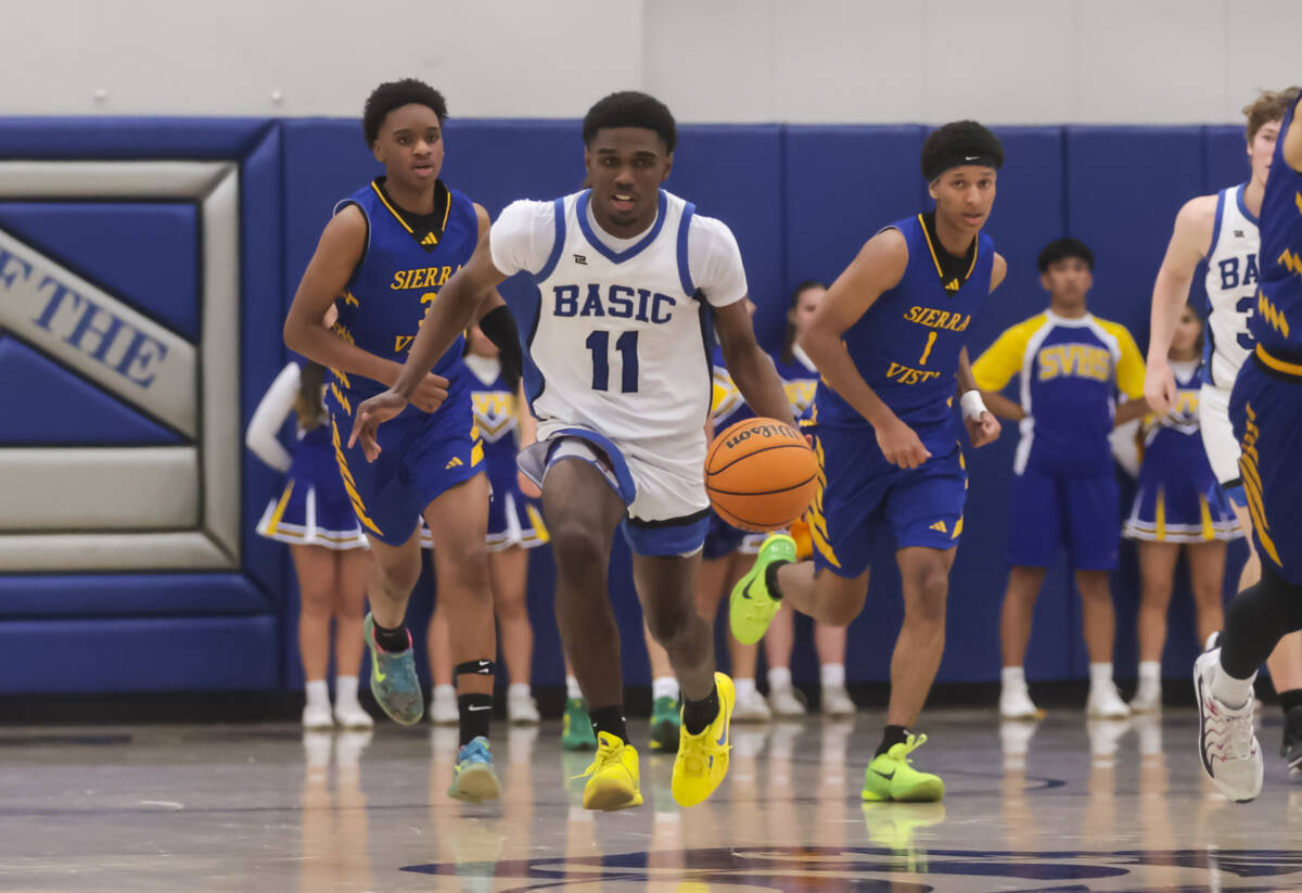 Basic guard JaMari Cottingham (11) drives the ball against Sierra Vista during a basketball gam ...