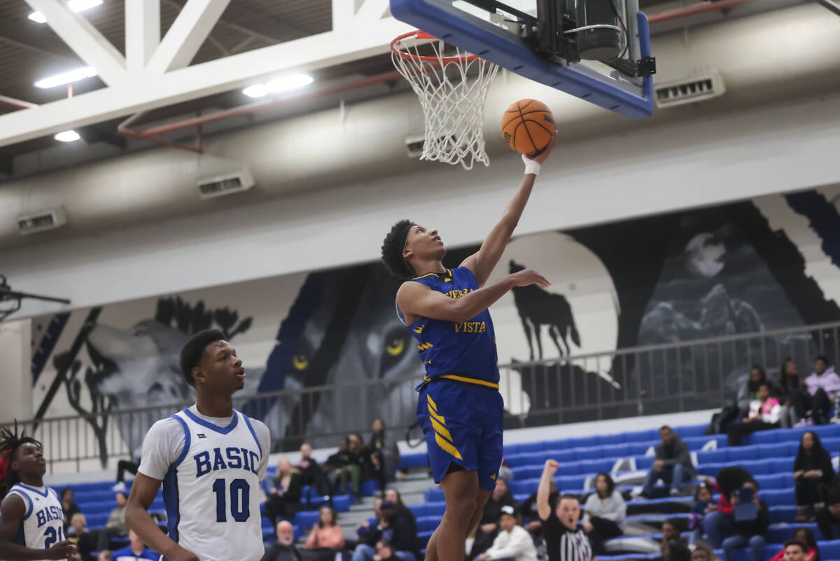 Sierra Vista guard Jevon Yapi (1) lays up the ball during a basketball game at Basic Academy on ...