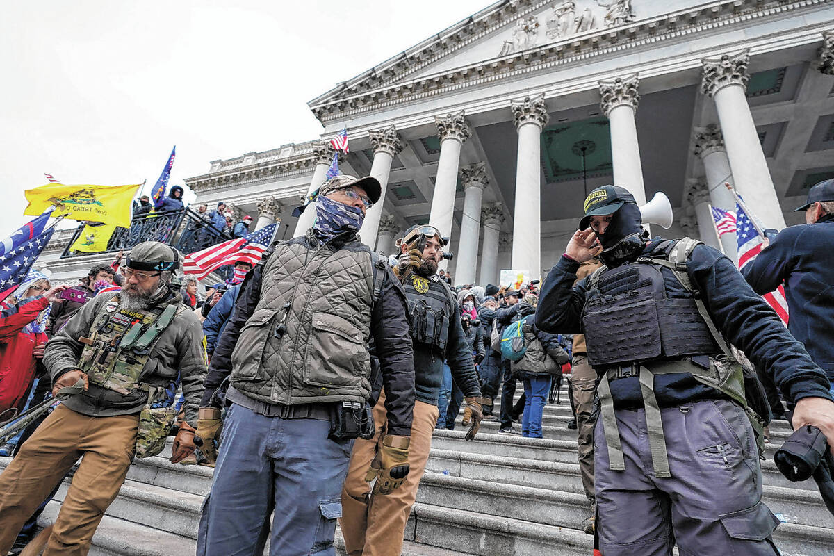 Members of the Oath Keepers stand on the East Front of the U.S. Capitol on Jan. 6, 2021, in Was ...