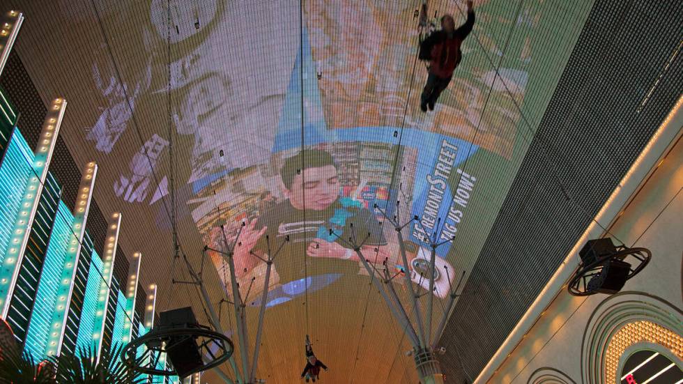 Visitors zip line above the Fremont Street Experience in Las Vegas. (Travel Nevada)