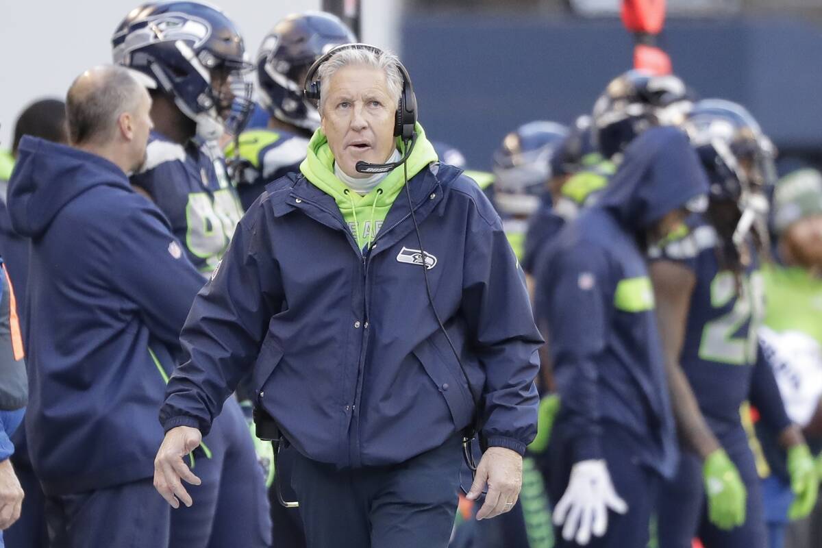 Seattle Seahawks head coach Pete Carroll looks toward the clock during the first half of an NFL ...