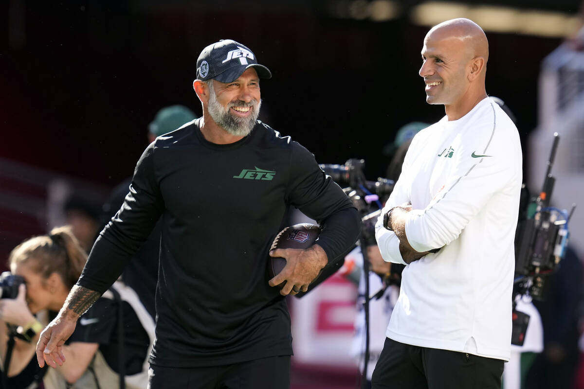 FILE - New York Jets head coach Robert Saleh, right, talks with defensive coordinator Jeff Ulb ...