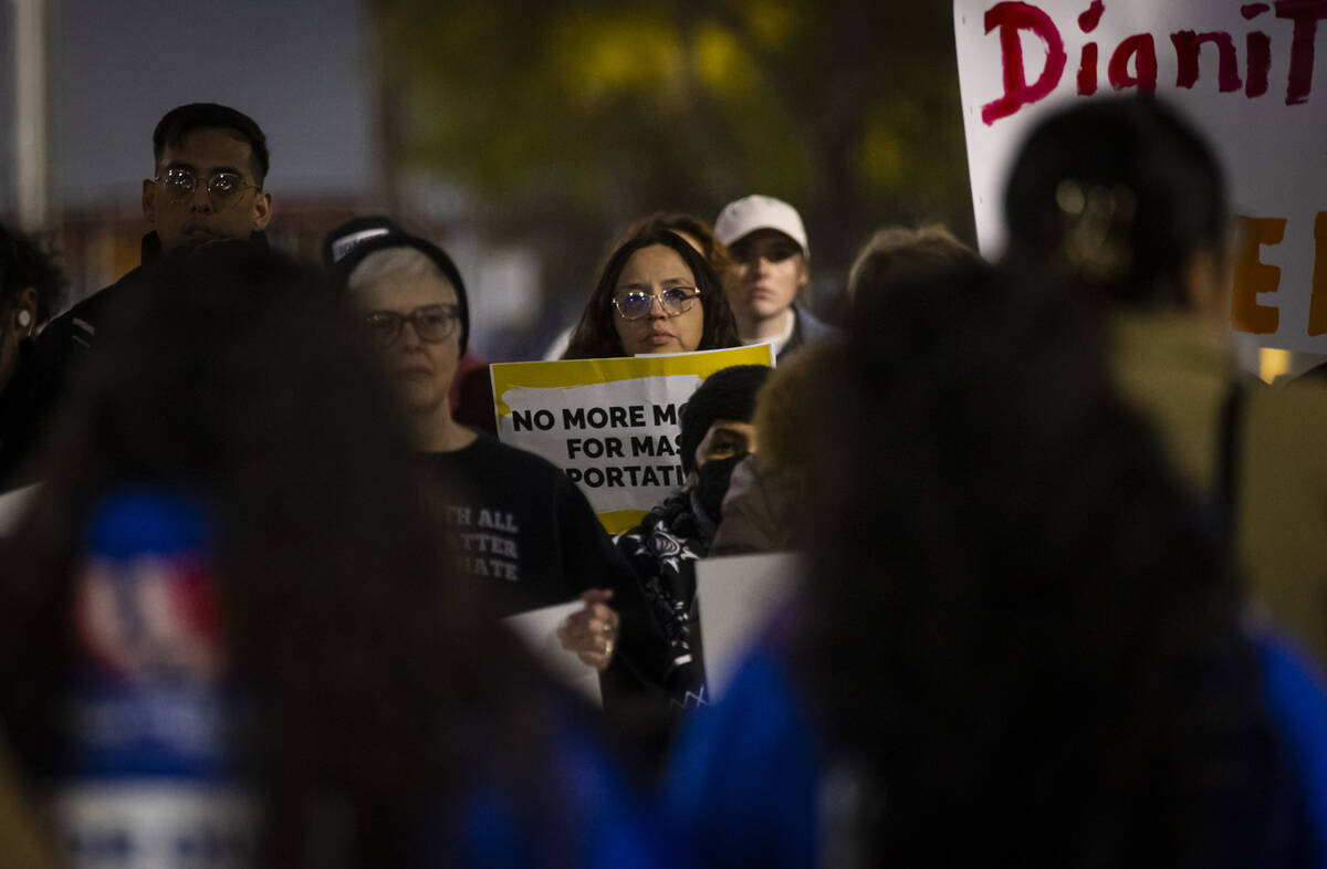 People listen to a speaker during a rally against newly established immigration policies from P ...