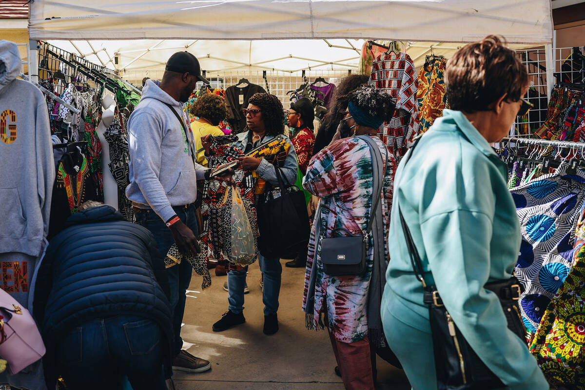 FILE - Attendees look at clothing for sale at the Springs Preserve’s 15th annual Black Histor ...