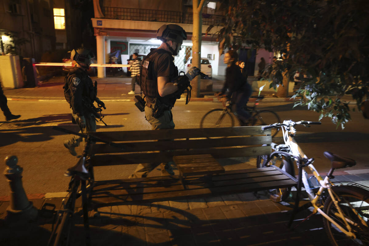 Israeli forces work at the scene of a stabbing attack, where Israeli police identified the atta ...