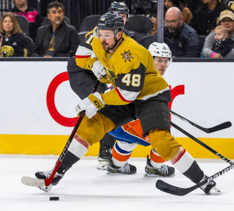 Golden Knights center Tomas Hertl (48) controls the puck past New York Islanders center Mathew ...