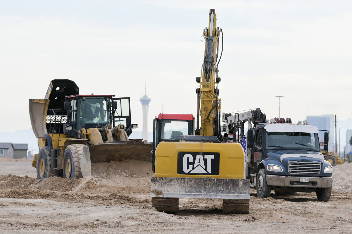 Construction equipment is staged during a ceremonial groundbreaking for the Hylo Park mixed-use ...