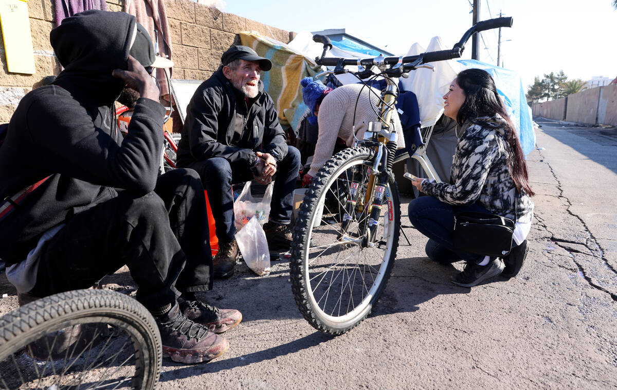 FILE - Brenda Barnes, Clark County social service assistant manager, surveys Robert Speers, 65, ...