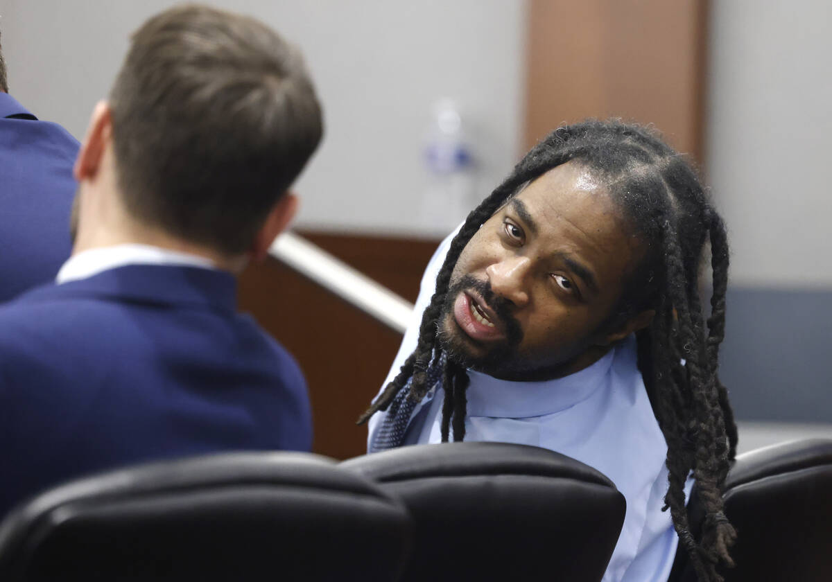 Anthony Newton, who's facing the death penalty for a 2016 murder, speaks to his attorney Josh T ...