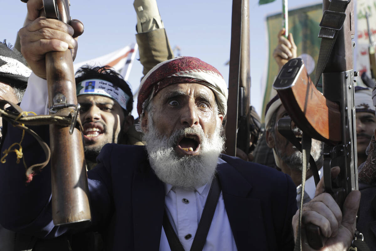 A Houthi supporter shouts slogans during during an anti-U.S and Israel rally in Sanaa, Yemen, F ...