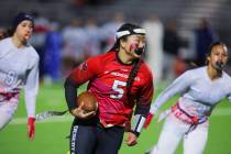 Desert Oasis quarterback Akemi Higa scrambles during a flag football game between Liberty and D ...