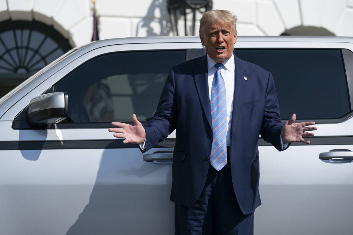 FILE - President Donald Trump talks about the Endurance all-electric pickup truck, made in Lord ...