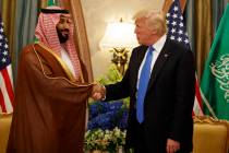 FILE- President Donald Trump shakes hands with Saudi Deputy Crown Prince and Defense Minister M ...