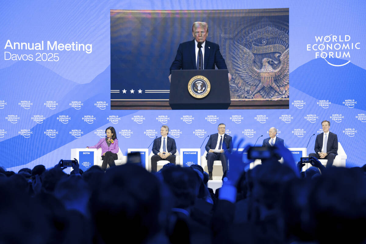 US President Donald J. Trump is shown on screens as he addresses via remote connection a plenar ...