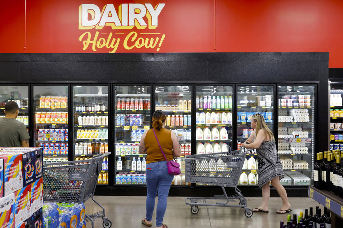 Shoppers navigate through the dairy aisle at Grocery Outlet Bargain Market, on Wednesday, June ...