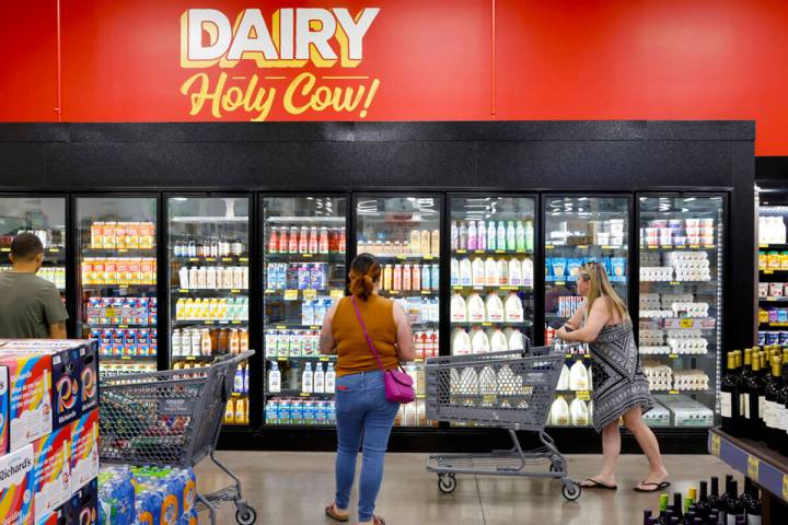 Shoppers navigate through the dairy aisle at Grocery Outlet Bargain Market, on Wednesday, June ...