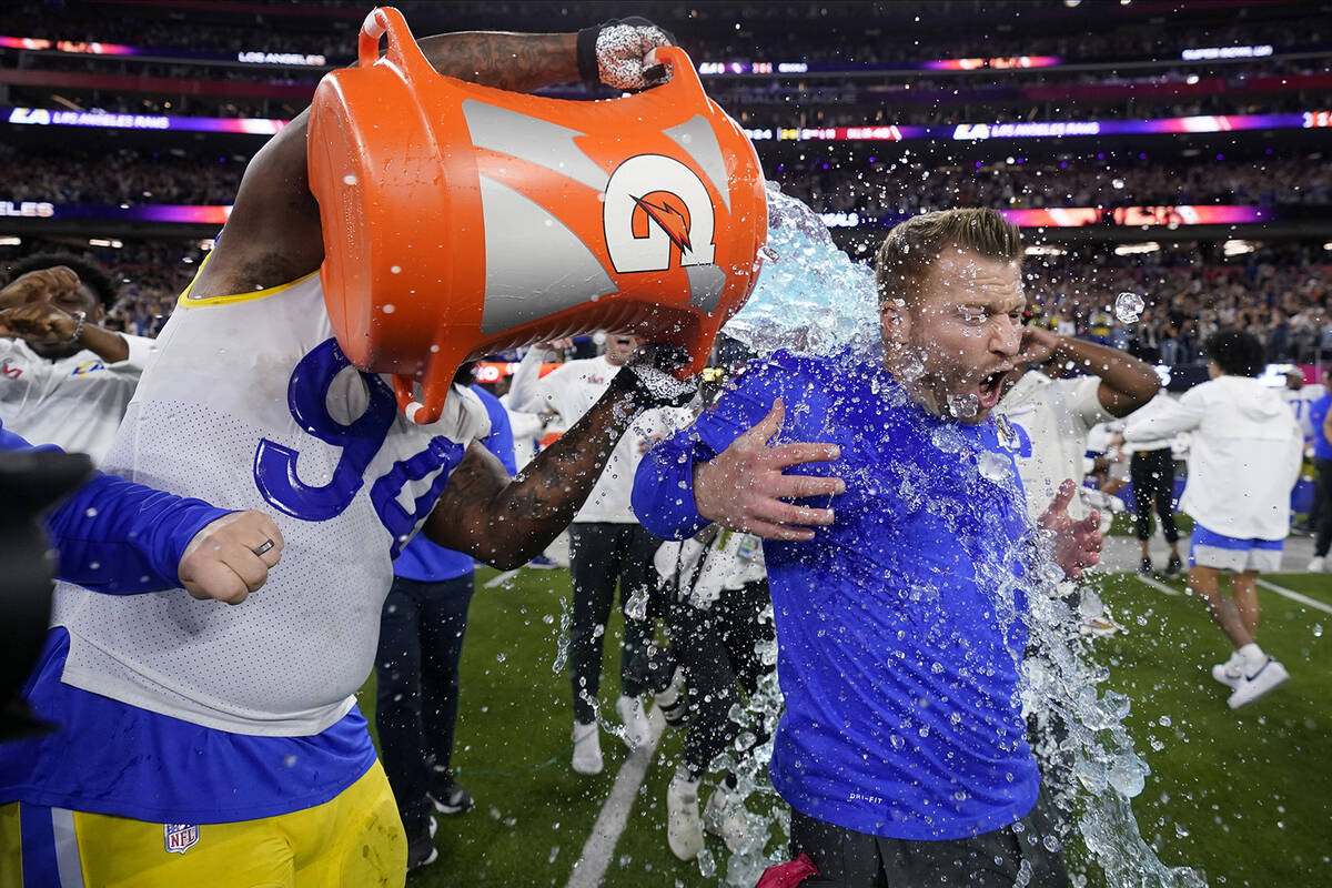 Los Angeles Rams defensive end A'Shawn Robinson, left, pours Gatorade over Los Angeles Rams hea ...