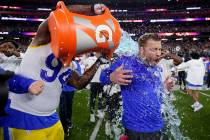 Los Angeles Rams defensive end A'Shawn Robinson, left, pours Gatorade over Los Angeles Rams hea ...