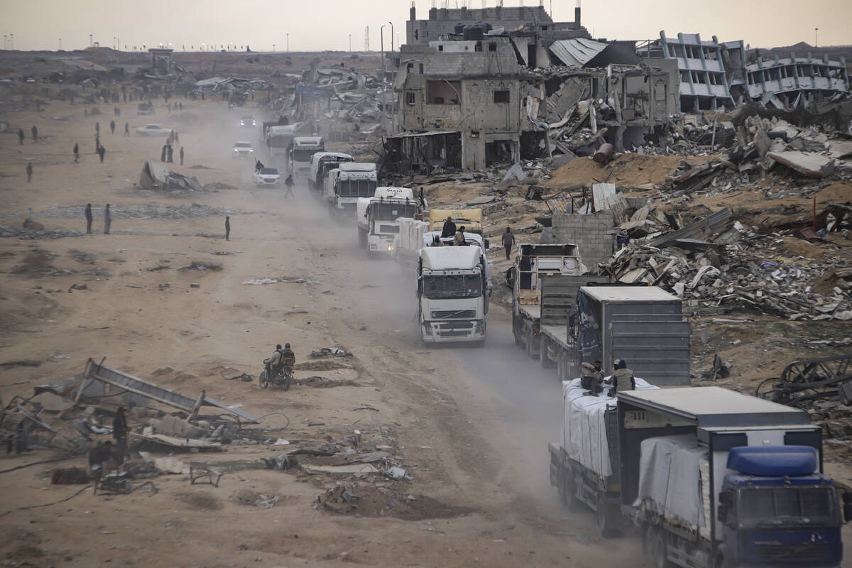 Humanitarian aid trucks enter through the Kerem Shalom crossing from Egypt into the Gaza Strip, ...