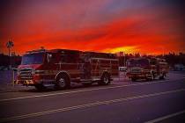 Las Vegas Fire Department crews leave nearly three weeks in the Los Angeles area as the sun set ...