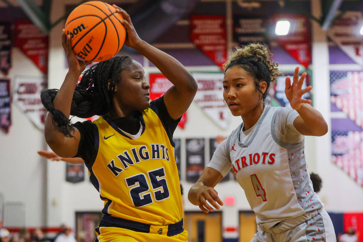 Democracy Prep forward ZhaNea Burrell (25) tries to keep the ball from Liberty guard Satsuki Br ...