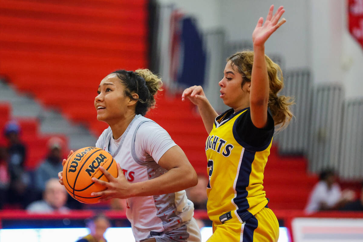 Liberty guard Satsuki Bradley (4) looks for an open teammate during a girls basketball game bet ...