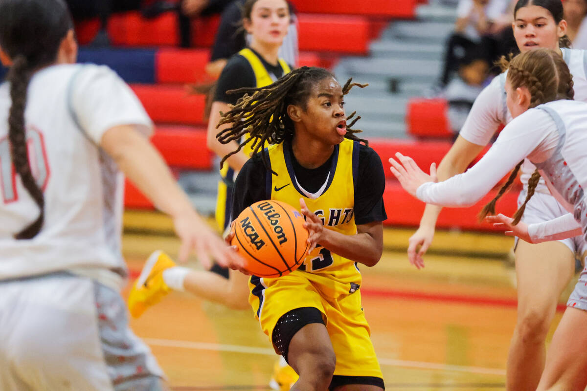 Democracy Prep guard Keonni Lewis (13) drives towards the net during a girls basketball game be ...