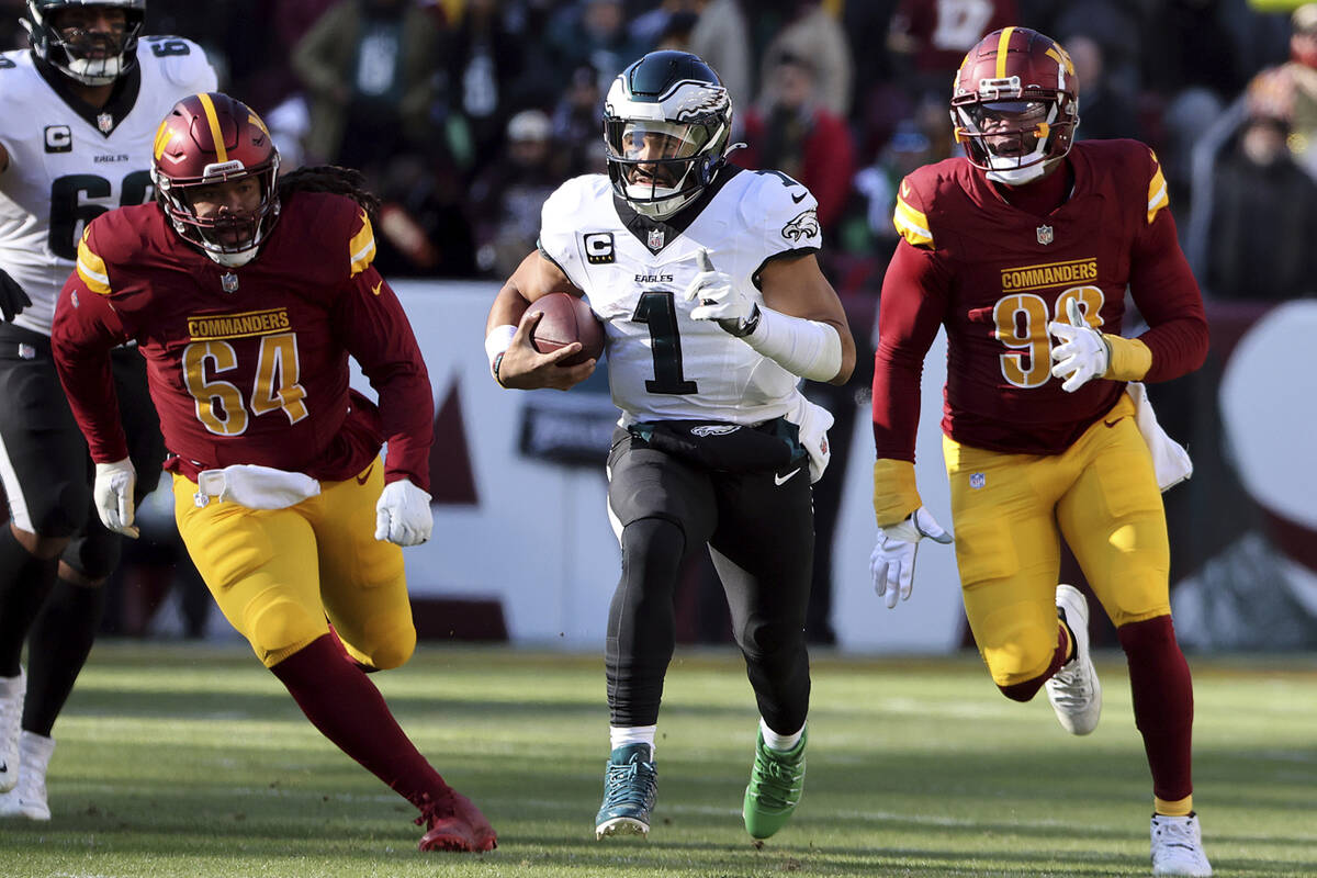 Philadelphia Eagles quarterback Jalen Hurts (1) runs with the ball during an NFL football game ...