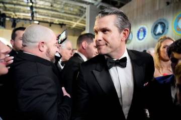 Defense Secretary nominee Pete Hegseth, center, attends the Commander in Chief Ball, Monday, Ja ...