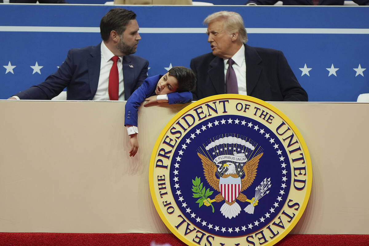 Vice President JD Vance, left, President Donald Trump, right, and Vance's son Vivek attend at a ...