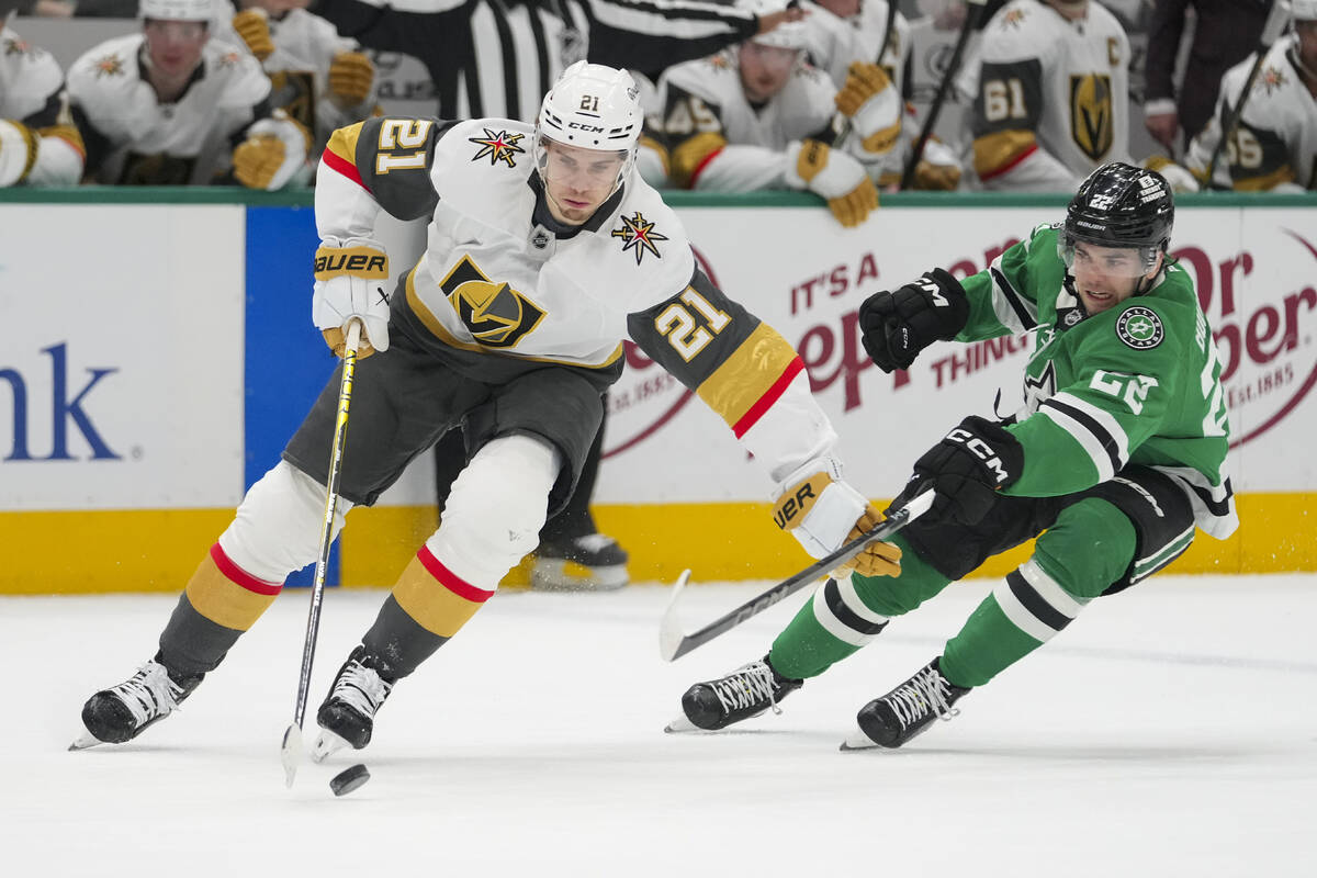 Vegas Golden Knights center Brett Howden (21) skates with the puck against Dallas Stars center ...