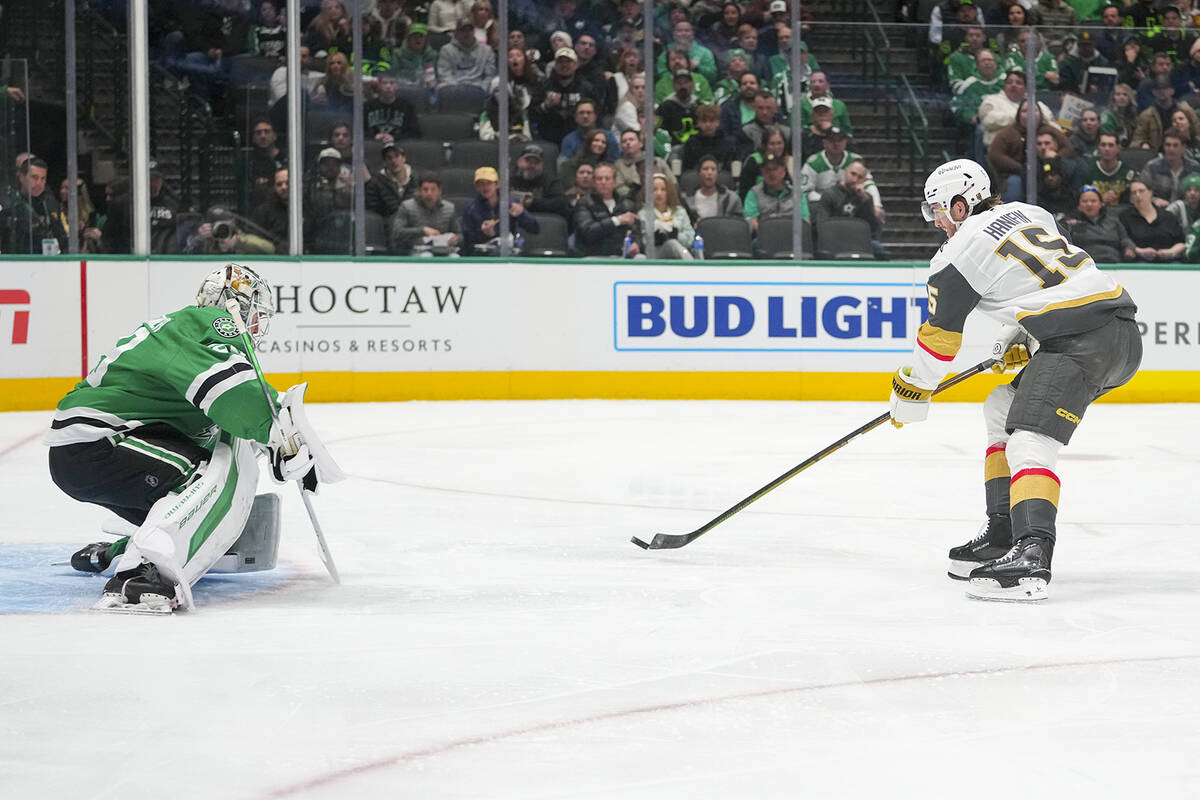 Vegas Golden Knights defenseman Noah Hanifin, right, attacks against Dallas Stars goaltender Ja ...