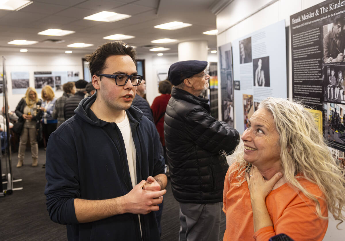 Hank Labastida, 17, left, speaks alongside Sharon Roth while visiting the "The Holocaust: ...