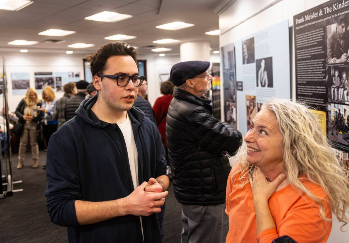 Hank Labastida, 17, left, speaks alongside Sharon Roth while visiting the "The Holocaust: ...