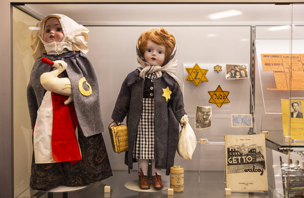 A variety of exhibit items are seen at the "The Holocaust: Reconstructing Shattered Humani ...