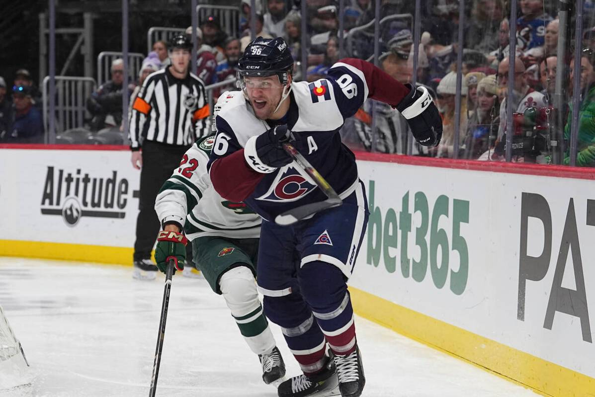 Colorado Avalanche right wing Mikko Rantanen (96) and Minnesota Wild center Marat Khusnutdinov ...