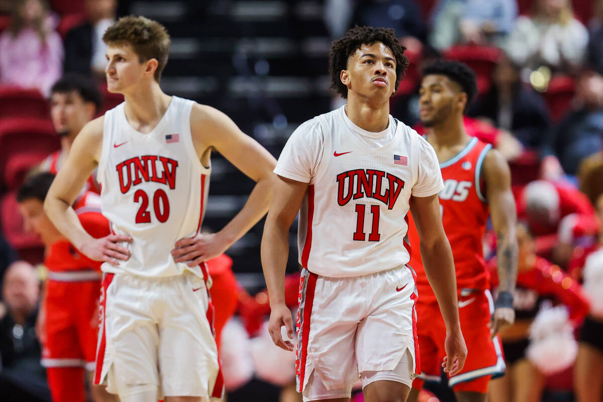 Rebels guard Dedan Thomas Jr. (11) walks back up the court during an NCAA basketball game betwe ...