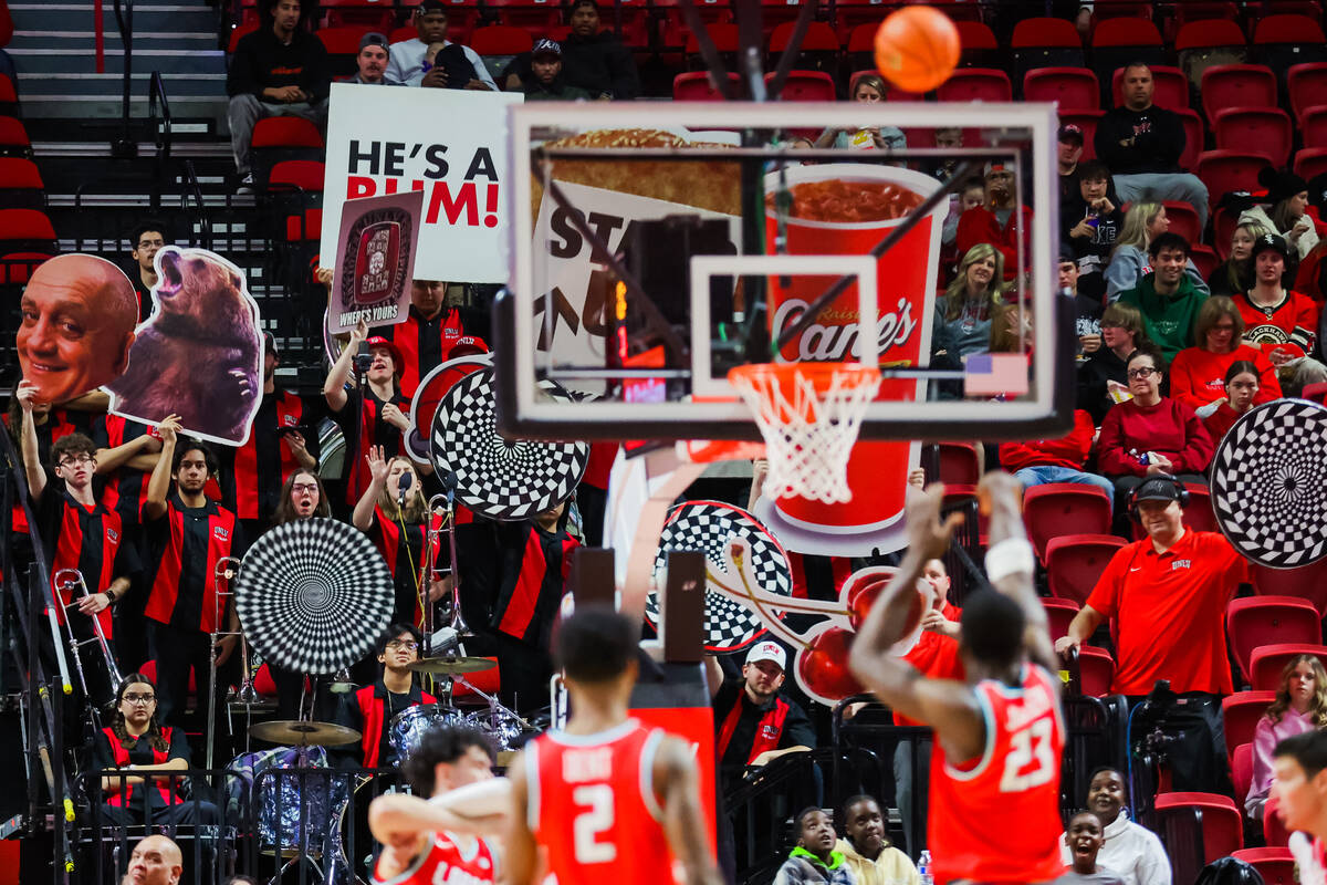 Rebels fans try to distract during a New Mexico Lobos free throw during an NCAA basketball game ...