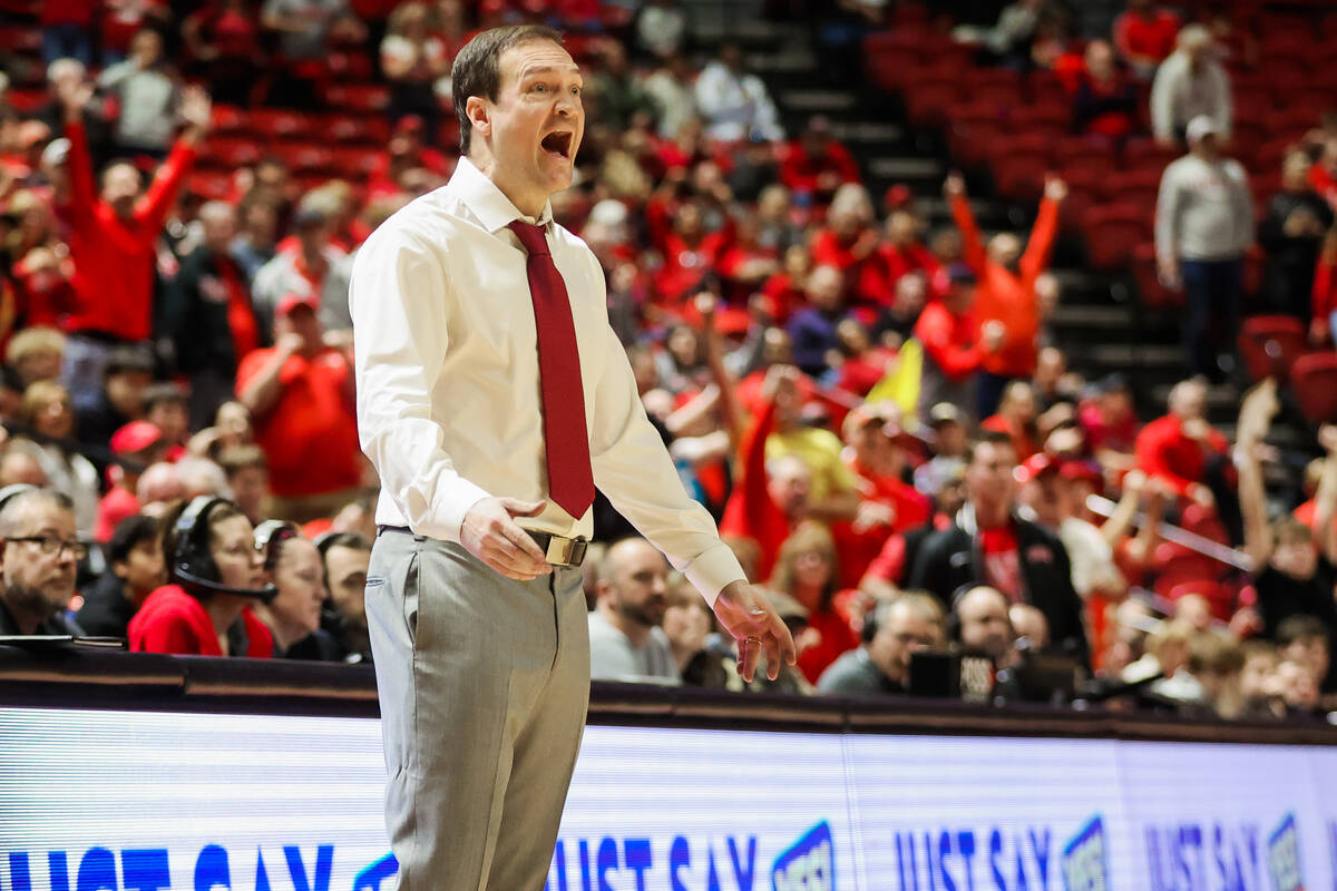 Rebels head coach Kevin Krueger reacts as Rebels guard Dedan Thomas Jr. misses a free throw tha ...