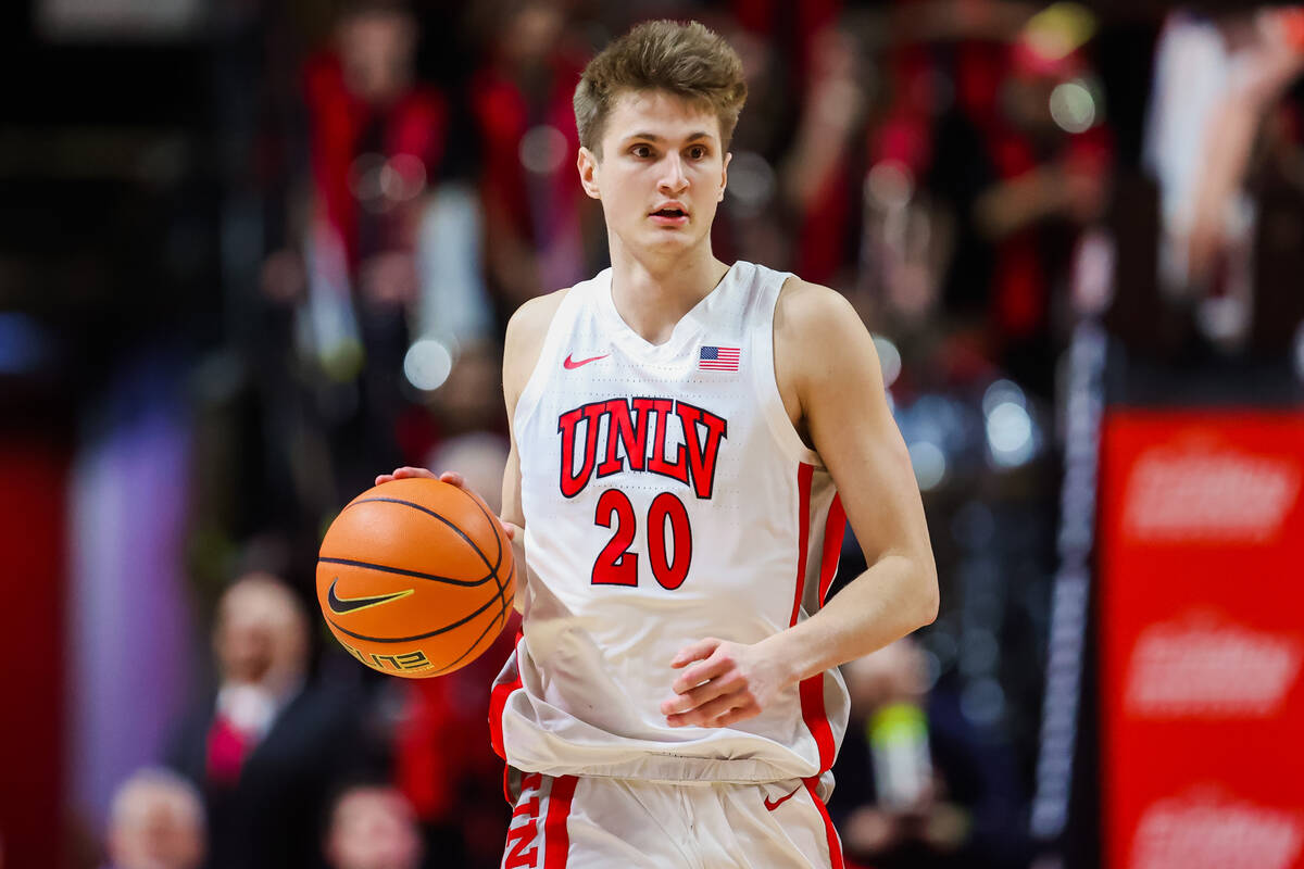 Rebels guard Julian Rishwain dribbles the ball during an NCAA basketball game between the Rebel ...