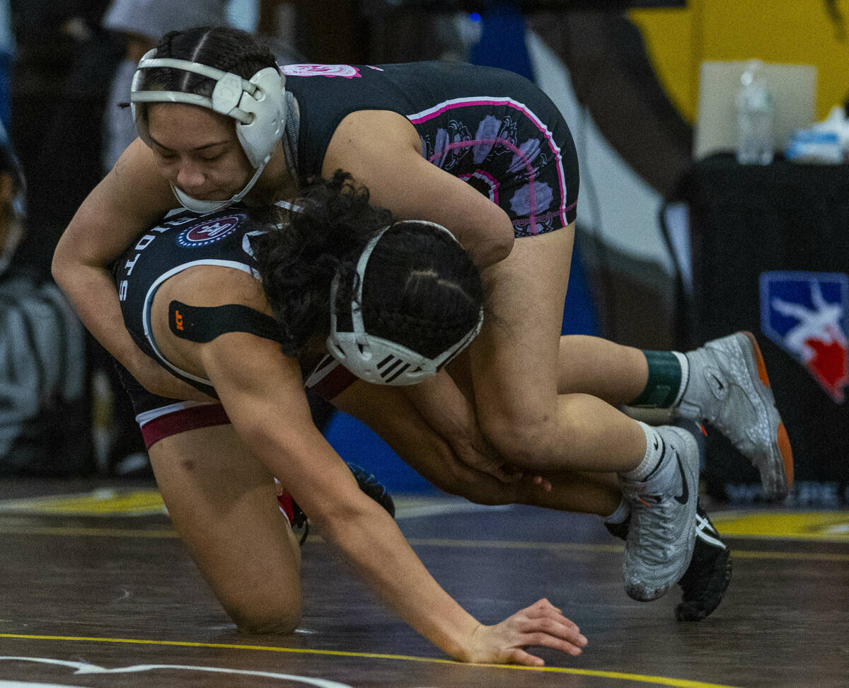 SLAM Academy’s Noelani Lutz turns Liberty’s Chanity Faleto onto the mat during th ...