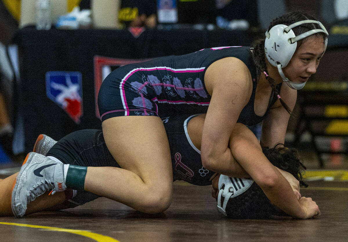 SLAM Academy’s Noelani Lutz drives Liberty’s Chanity Faleto into the mat during t ...